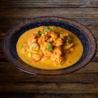 Crevetten in fruchtig-cremiger Mango-Curry-Sauce bei India4U Bern – exotisch & fein abgestimmt
